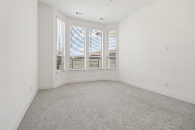 2208 13th St, Argyle, TX 76226 - empty room with light carpet, plenty of natural light, and baseboards