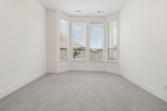 2208 13th St, Argyle, TX 76226 - spare room featuring light carpet and baseboards