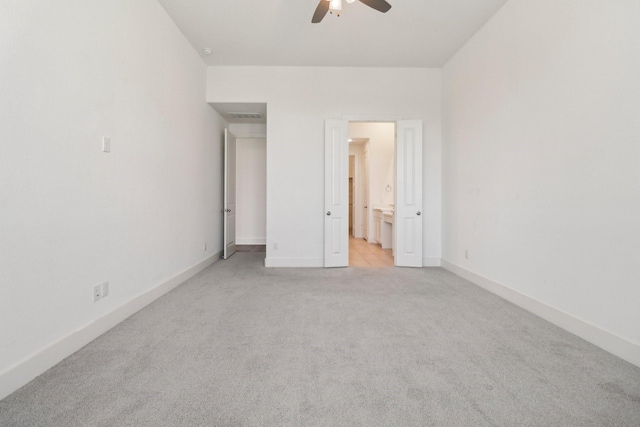 2208 13th St, Argyle, TX 76226 - unfurnished bedroom featuring light colored carpet, connected bathroom, baseboards, and ceiling fan