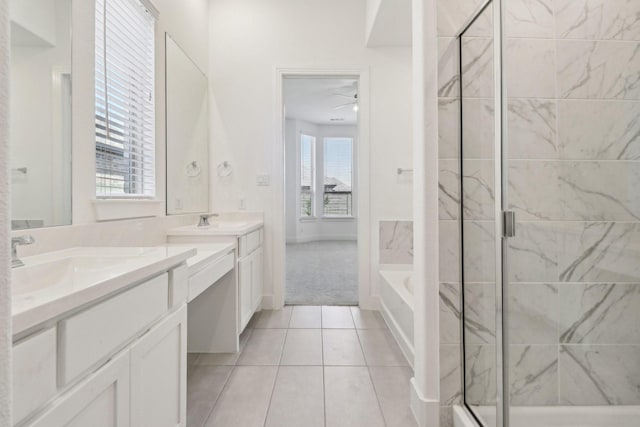 2208 13th St, Argyle, TX 76226 - bathroom with a stall shower, two vanities, a bath, tile patterned floors, and ceiling fan