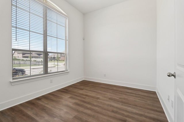2208 13th St, Argyle, TX 76226 - unfurnished room featuring baseboards and dark wood-type flooring