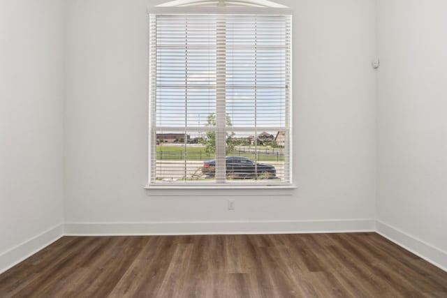 2208 13th St, Argyle, TX 76226 - spare room featuring dark wood-type flooring and baseboards