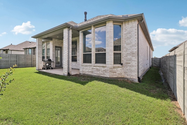 2208 13th St, Argyle, TX 76226 - back of property with brick siding and a patio area