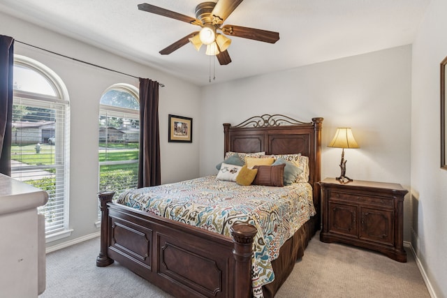 4008 Lynbrook Ln, Arlington, TX 76015 - bedroom with light carpet, baseboards, and ceiling fan