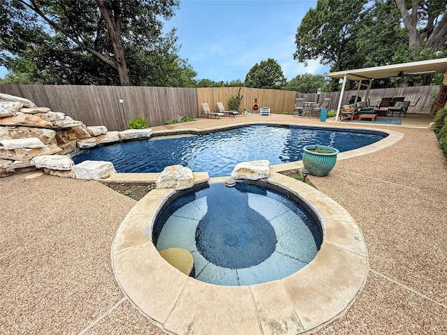 4008 Lynbrook Ln, Arlington, TX 76015 - view of pool with a fenced backyard, a patio, a pool with connected hot tub, and an outdoor hangout area