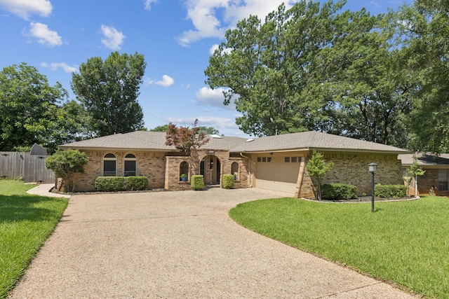 4008 Lynbrook Ln, Arlington, TX 76015 - ranch-style home with driveway, an attached garage, and brick siding