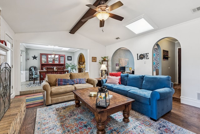 4008 Lynbrook Ln, Arlington, TX 76015 - living room with wood finished floors, arched walkways, ceiling fan, and a chandelier