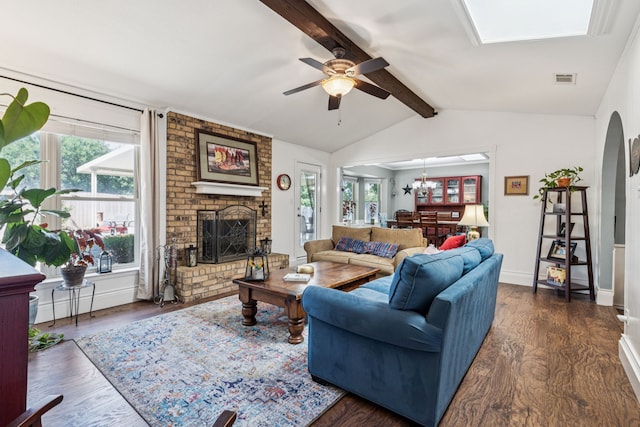 4008 Lynbrook Ln, Arlington, TX 76015 - living area featuring a brick fireplace, ceiling fan, dark wood-type flooring, and a chandelier