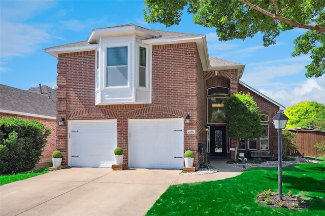 2201 Heatherton Pl, Plano, TX 75023 - traditional home with an attached garage, brick siding, driveway, and a shingled roof