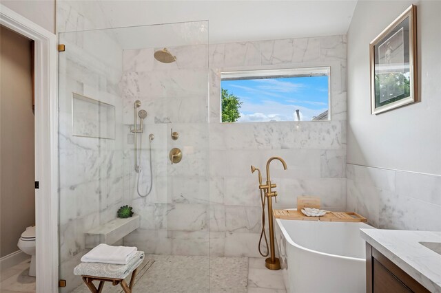 2201 Heatherton Pl, Plano, TX 75023 - bathroom with marble finish floors, a freestanding tub, walk in shower, vanity, and toilet