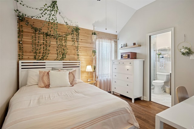 2201 Heatherton Pl, Plano, TX 75023 - bedroom with lofted ceiling, wood finished floors, connected bathroom, and wooden walls