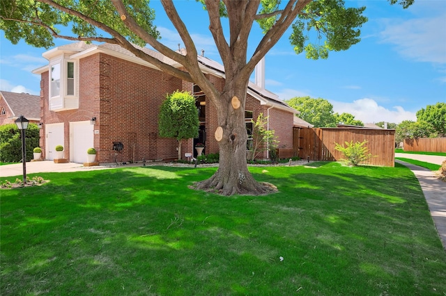 2201 Heatherton Pl, Plano, TX 75023 - view of yard with a garage and concrete driveway