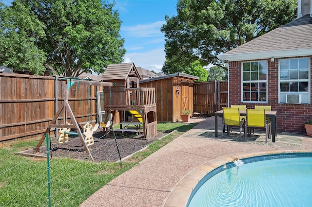 2201 Heatherton Pl, Plano, TX 75023 - view of swimming pool featuring a playground, a patio, a fenced backyard, cooling unit, and outdoor dining space