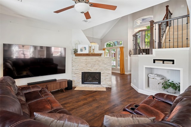 2201 Heatherton Pl, Plano, TX 75023 - living area featuring ceiling fan, wood finished floors, baseboards, a stone fireplace, and stairway