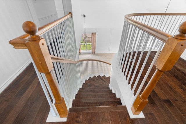 12809 Conifer Ln, Fort Worth, TX 76040 - stairway with hardwood / wood-style floors and a decorative wall