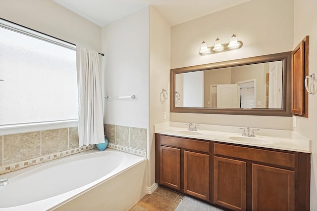 7009 Bishop Pine Rd, Denton, TX 76208 - bathroom featuring plenty of natural light, a garden tub, and double vanity