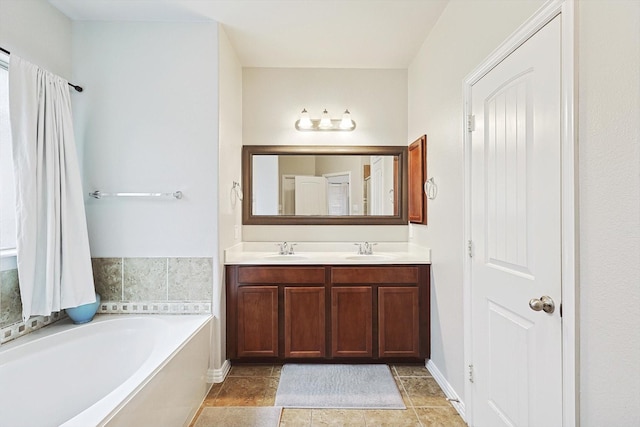 7009 Bishop Pine Rd, Denton, TX 76208 - full bathroom featuring double vanity, a garden tub, and baseboards