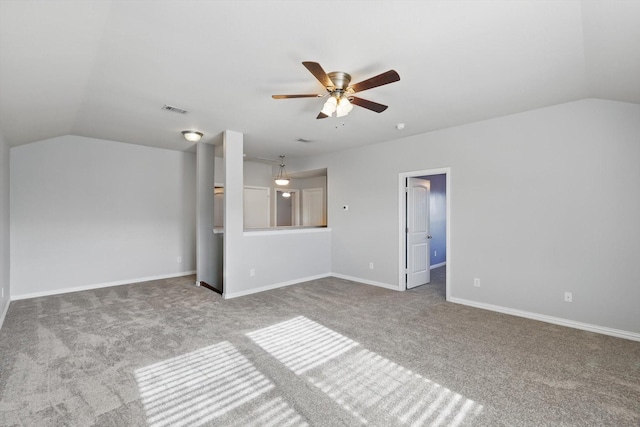 7009 Bishop Pine Rd, Denton, TX 76208 - empty room with carpet flooring, vaulted ceiling, a ceiling fan, and baseboards