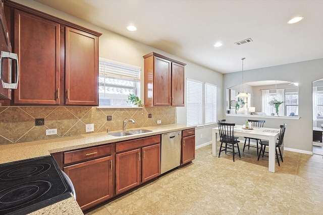 7009 Bishop Pine Rd, Denton, TX 76208 - kitchen featuring dishwasher, a sink, plenty of natural light, decorative backsplash, and recessed lighting