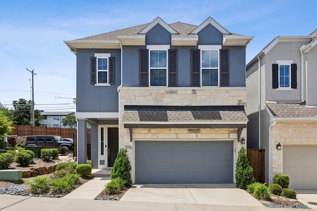 2070 White Grove Dr, Dallas, TX 75228 - view of front facade featuring an attached garage, stone siding, concrete driveway, and stucco siding