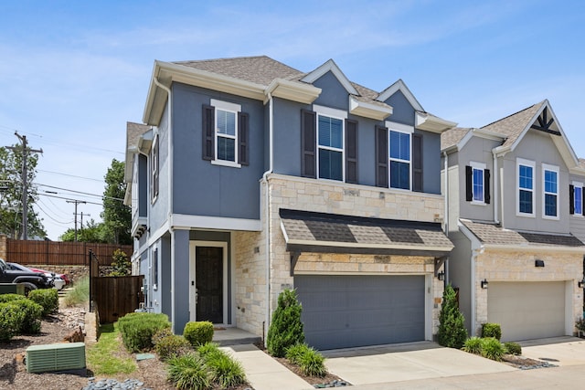 2070 White Grove Dr, Dallas, TX 75228 - multi unit property with stone siding, a garage, stucco siding, and concrete driveway