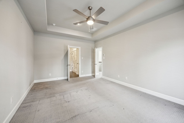 2070 White Grove Dr, Dallas, TX 75228 - unfurnished bedroom featuring baseboards, a raised ceiling, carpet, and a ceiling fan