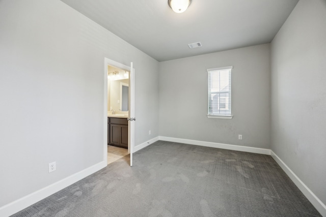 2070 White Grove Dr, Dallas, TX 75228 - spare room featuring carpet flooring, a sink, and baseboards