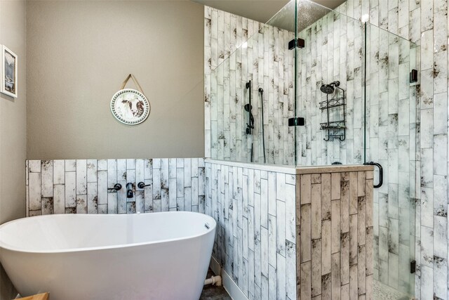 4620 County Road 707, Cleburne, TX 76031 - full bathroom with a soaking tub and a stall shower