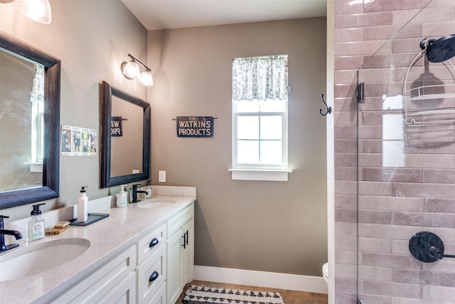 4620 County Road 707, Cleburne, TX 76031 - full bath featuring double vanity, a tile shower, toilet, and baseboards