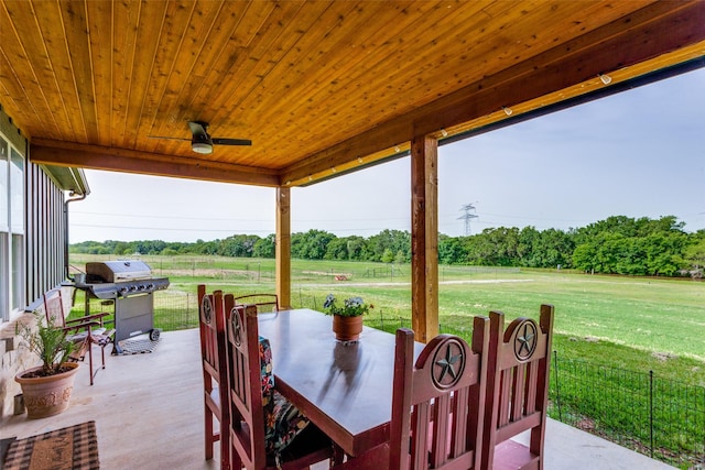 4620 County Road 707, Cleburne, TX 76031 - view of patio / terrace featuring a grill, outdoor dining area, view of wooded area, and ceiling fan