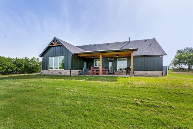 4620 County Road 707, Cleburne, TX 76031 - rear view of property featuring board and batten siding, a patio, a yard, ceiling fan, and roof with shingles