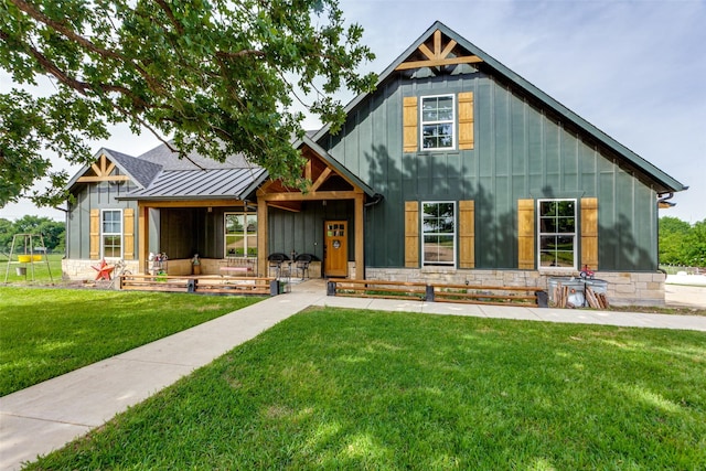 4620 County Road 707, Cleburne, TX 76031 - modern inspired farmhouse with board and batten siding, a front yard, a standing seam roof, metal roof, and stone siding