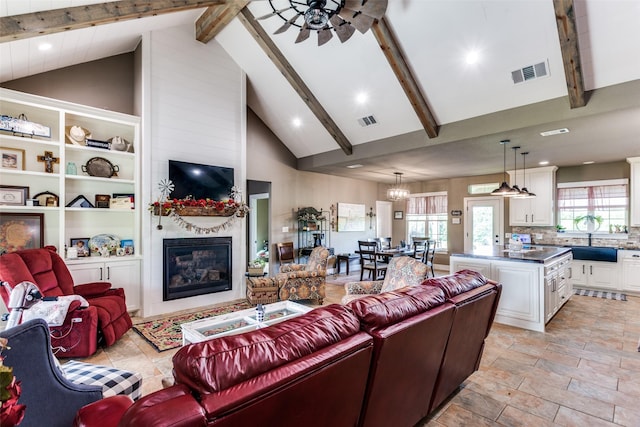 4620 County Road 707, Cleburne, TX 76031 - living room with a large fireplace, ceiling fan, high vaulted ceiling, beamed ceiling, and recessed lighting