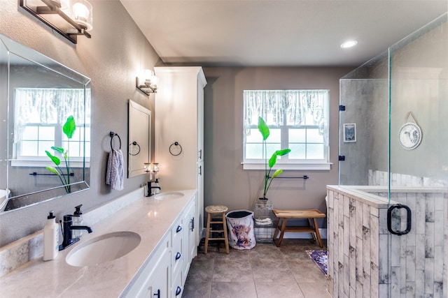 4620 County Road 707, Cleburne, TX 76031 - full bathroom with double vanity, healthy amount of natural light, a stall shower, and recessed lighting