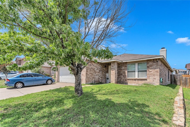 5408 Lansdowne Ave, Fort Worth, TX 76135 - view of front of home with concrete driveway, brick siding, a chimney, and a garage