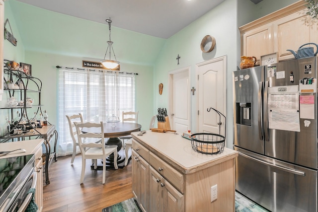 2516 Rushing Springs Dr, Fort Worth, TX 76118 - kitchen featuring stainless steel fridge with ice dispenser, lofted ceiling, light brown cabinets, wood finished floors, and light countertops