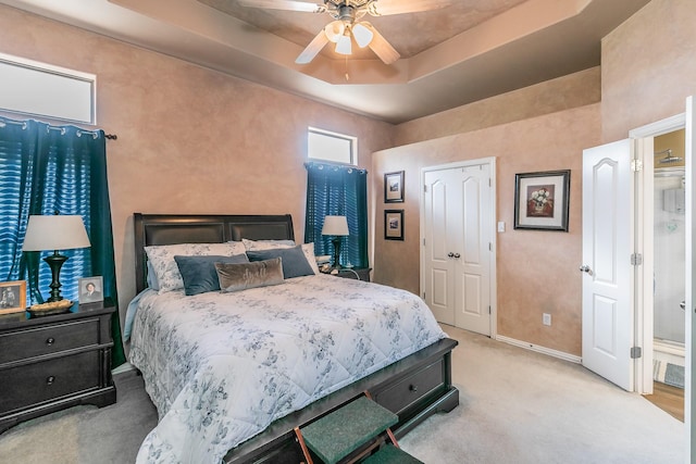 2516 Rushing Springs Dr, Fort Worth, TX 76118 - carpeted bedroom featuring baseboards, a raised ceiling, and ceiling fan