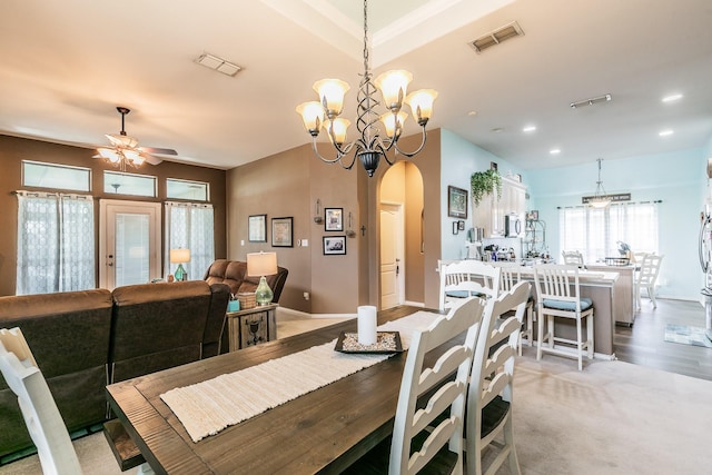 2516 Rushing Springs Dr, Fort Worth, TX 76118 - dining area featuring arched walkways, a ceiling fan, a chandelier, recessed lighting, and baseboards