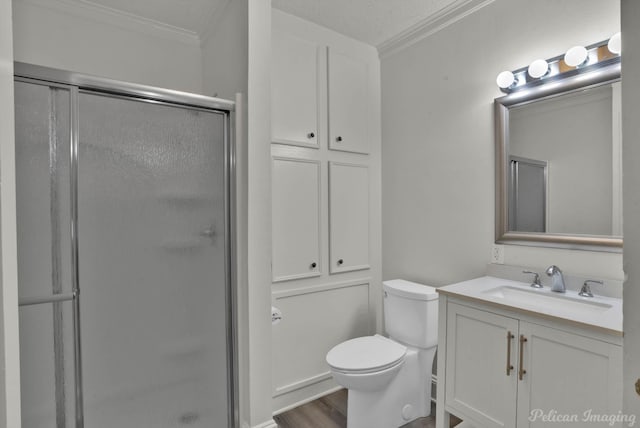 350 Albany Ave, Shreveport, LA 71105 - bathroom with crown molding, a shower stall, vanity, toilet, and wood finished floors