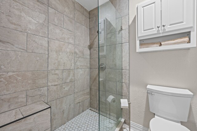 3212 Santana Ln, Plano, TX 75023 - bathroom featuring toilet and a tile shower