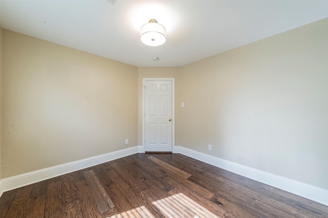 2231 Templeton Dr, Arlington, TX 76006 - unfurnished room featuring dark wood finished floors and baseboards