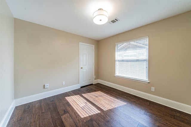 2231 Templeton Dr, Arlington, TX 76006 - spare room with dark wood finished floors and baseboards