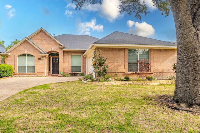 2231 Templeton Dr, Arlington, TX 76006 - view of front facade featuring brick siding, a front lawn, driveway, and roof with shingles