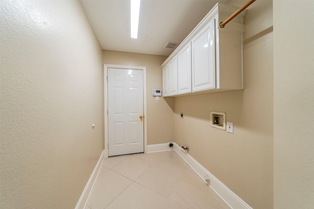 2231 Templeton Dr, Arlington, TX 76006 - laundry room featuring hookup for a gas dryer, electric dryer hookup, baseboards, hookup for a washing machine, and light tile patterned floors