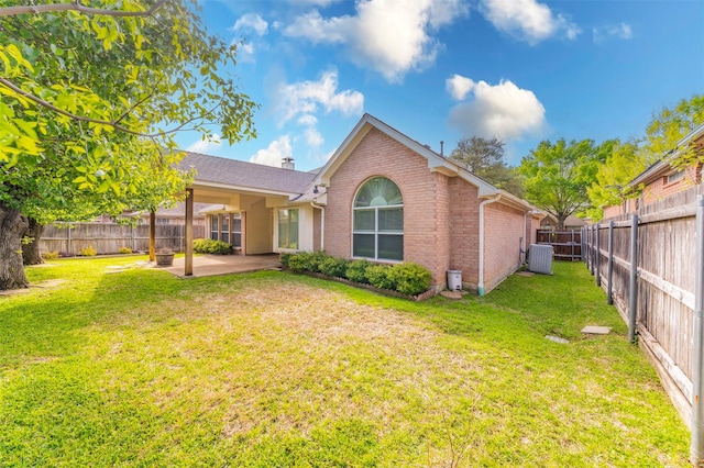2231 Templeton Dr, Arlington, TX 76006 - rear view of house featuring brick siding, a patio area, and central air condition unit