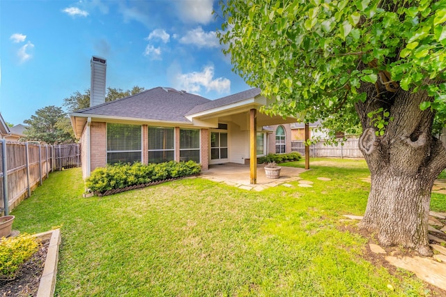 2231 Templeton Dr, Arlington, TX 76006 - back of house with a patio, brick siding, a chimney, and a shingled roof
