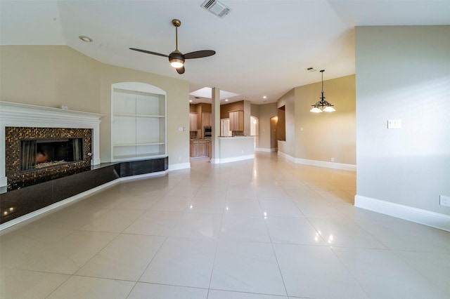 2231 Templeton Dr, Arlington, TX 76006 - unfurnished living room featuring ceiling fan, baseboards, light tile patterned flooring, a high end fireplace, and vaulted ceiling