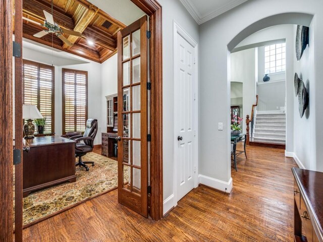 11483 Mirage Ln, Frisco, TX 75033 - office space featuring arched walkways, ceiling fan, wood finished floors, ornamental molding, and baseboards
