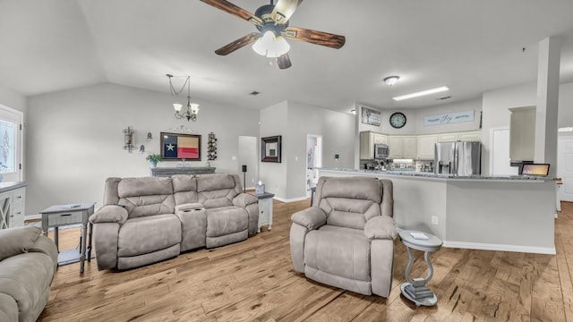 229 Willow Creek Dr, Weatherford, TX 76085 - living area with ceiling fan, light wood-style floors, a chandelier, lofted ceiling, and baseboards