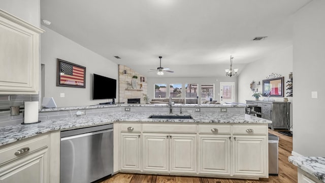 229 Willow Creek Dr, Weatherford, TX 76085 - kitchen with stainless steel dishwasher, a sink, ceiling fan, a stone fireplace, and light wood-style floors
